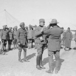 A Serbian Colonel showing an Indian Offcer how to use a Camera. Salonika, March 1917. © IWM Q 32816